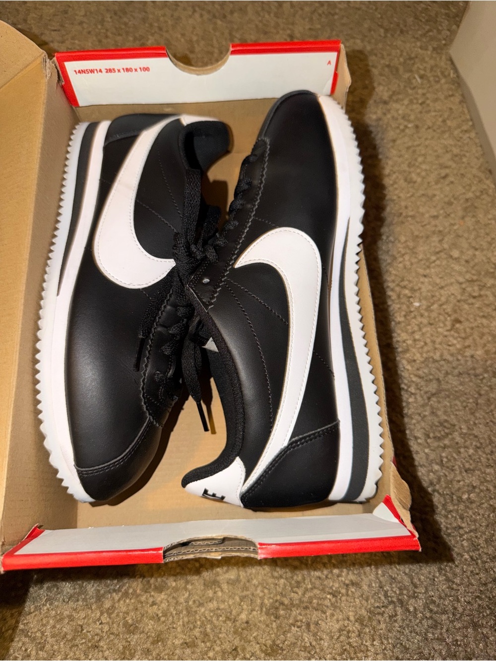 Women Nike Black and White Cortez Sneakers
